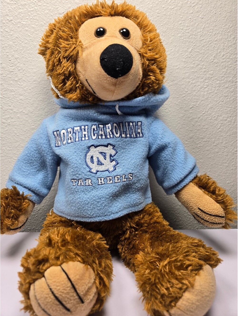 North Carolina Tar Heels bear plush in blue hoodie